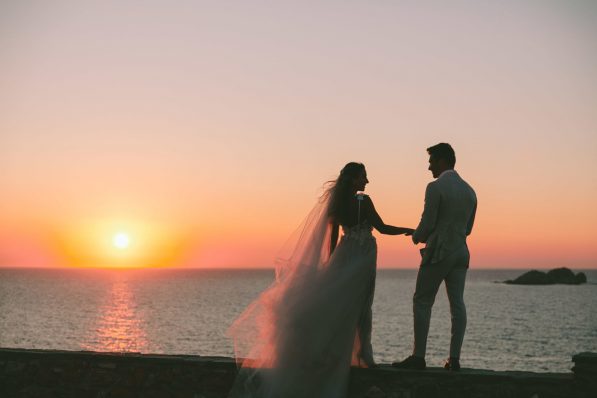 Planning a wedding in front of a beautiful sunset