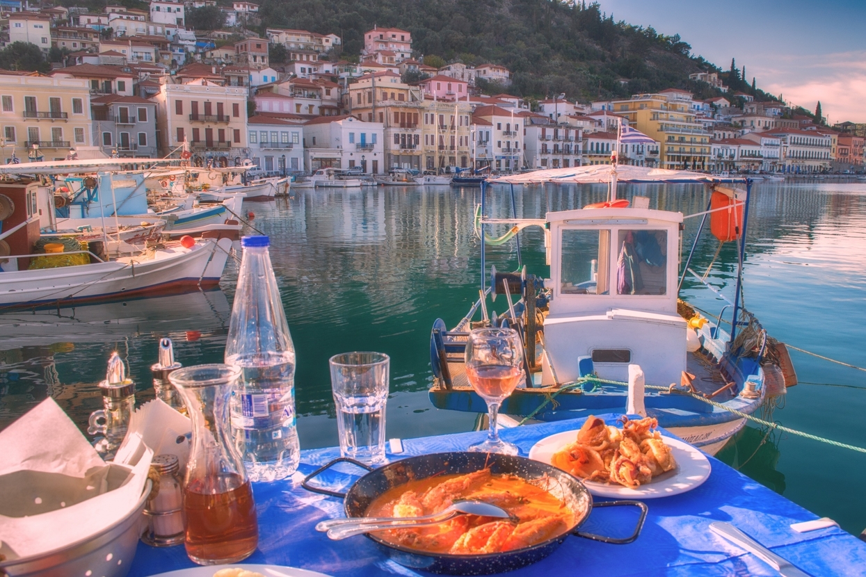 Greek food traditions, sea food dishes at a greek tavern next to the sea