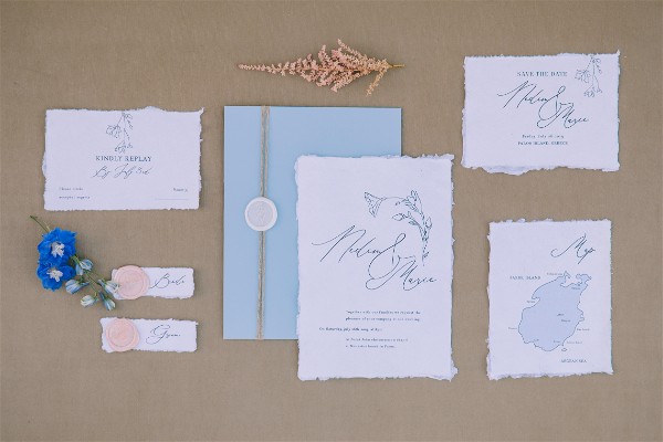 Greek wedding invitations stationery on brown background