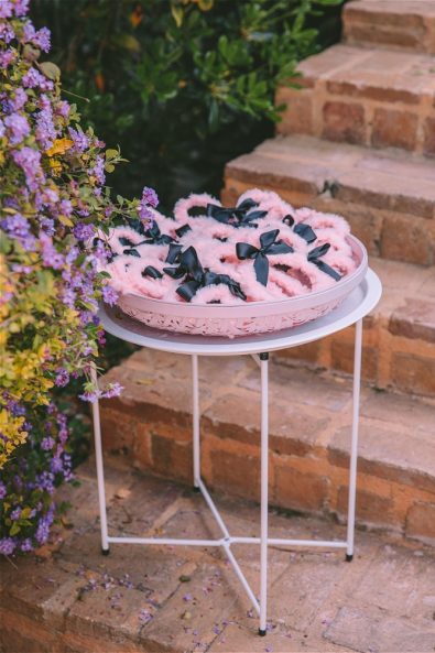 pink furry hairbands with black ribbons