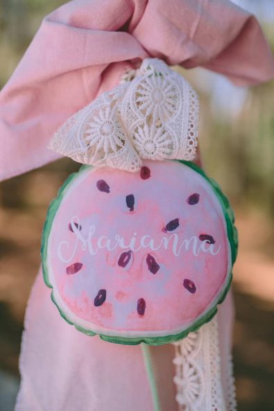 Watermelon inspired christening candle lambada with little round watermelon slice pillow and custom name, with crochet lace ribbon.