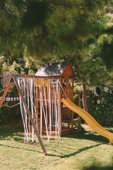 Decorated swings and slide at the garden