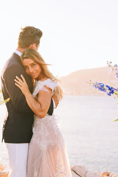 Bride and groom hugging at their elopement wedding in Paros