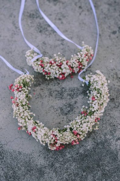 Flower crown and corsage with white and pink flowers.
