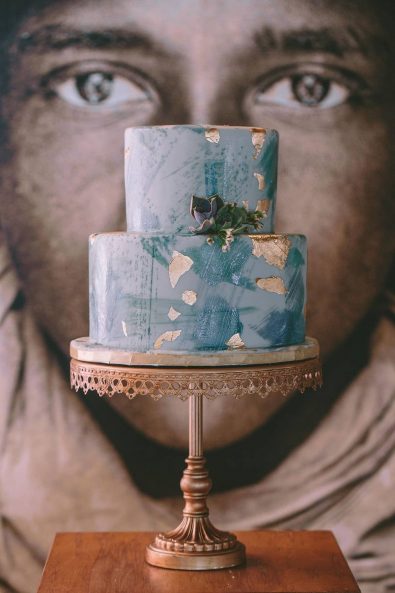 Modern art blue-green double wedding cake with gold foil.