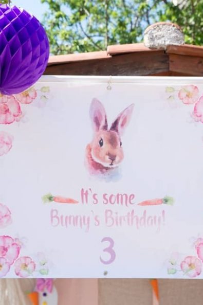 Party banner with pink and yellow watercolor flowers and bunny with