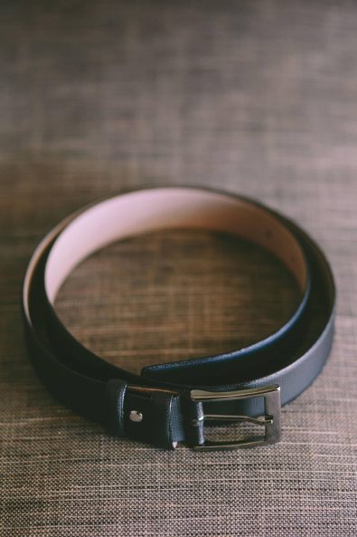 Groom's Black leather belt.