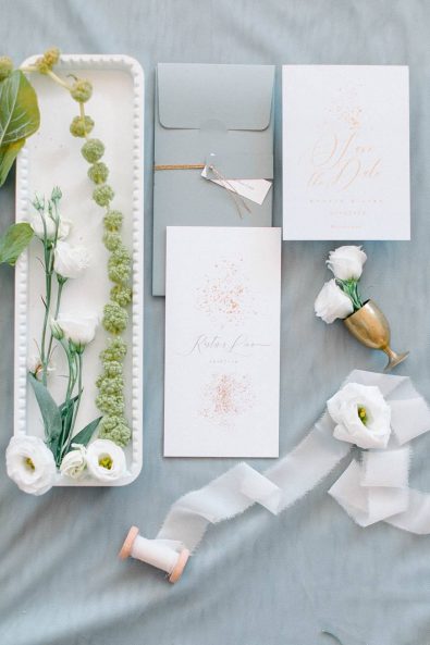 Minimal and chic wedding grey and gold elegant incitation with calligraphy on cream paper.
