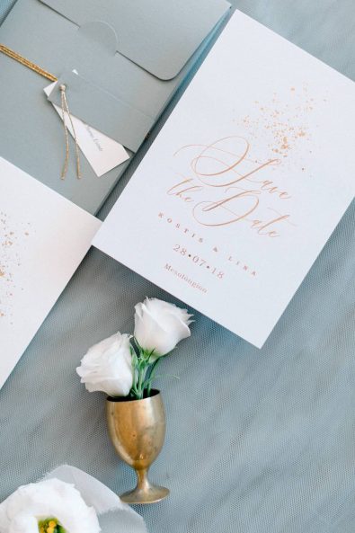 Minimal and chic fine art wedding invitation with grey, cream and gold details for a destination wedding in Greece.