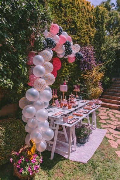 Balloons and flowers decorating candy bar
