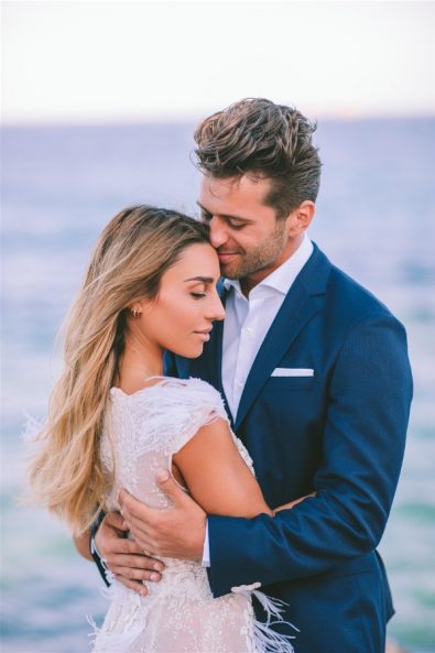 Groom hugging bride in elopement in Paros