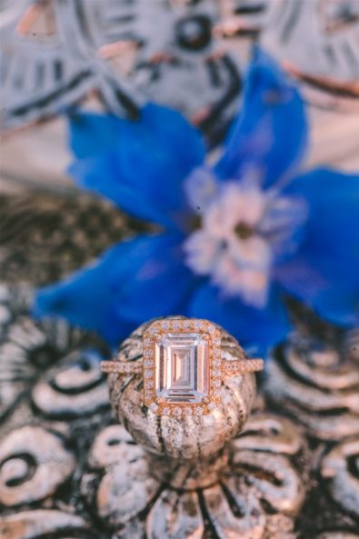 wedding ring in front of flower
