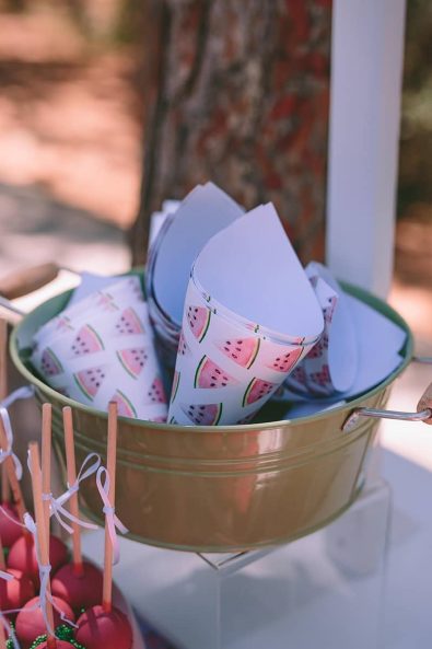 Custom-made watermelon print paper cones for candies and sweets for a baptism ceremony.