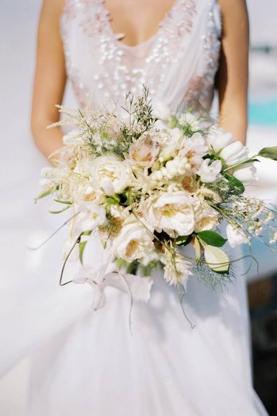 Boho organic summer wedding flowers with peonies, tulips, wildflower, and vine.