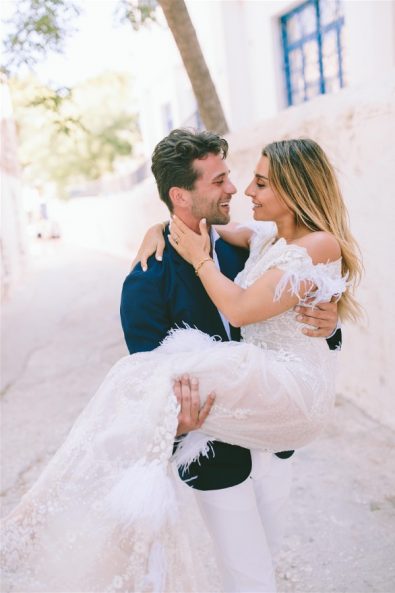 Groom picking up bride