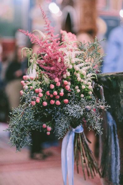 Pine, hypericum berries and pampas grass flower arrangement for a baptistery.
