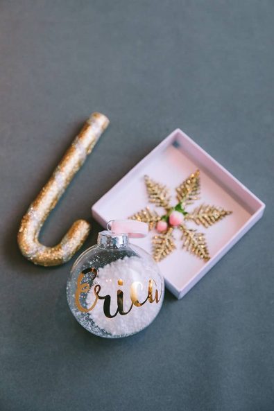 Custom-made christening favor with personalized glasss Christmas bauble filled with snow and velvet ribbon hanger.