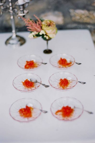 Traditional greek caramelized quince treats in little glass plates.