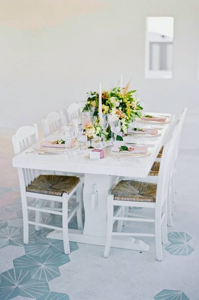 Set table for a simple and elegant wedding reception in Mykonos.