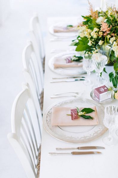 Elegant and minimal fine art table setting with peach and pink shades.