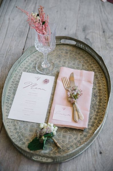 Wedding menu inspiration and pink linen napkin and silver flatware on a vintage serving tray.