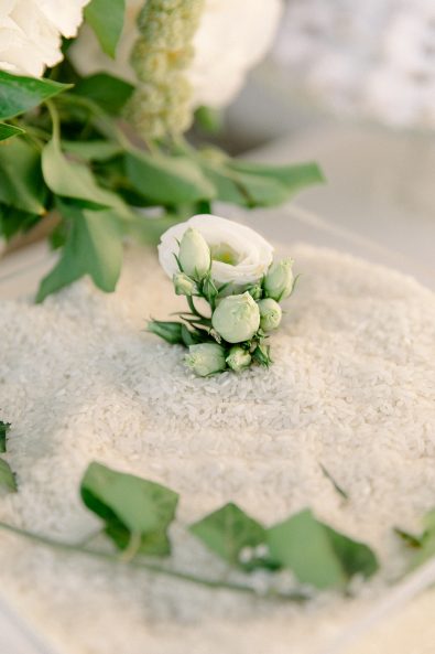 Minimal and chic white wedding boutonniere