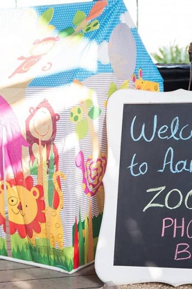 Party Photobooth inspiration with a tent and jungle animals for a boy baptism.