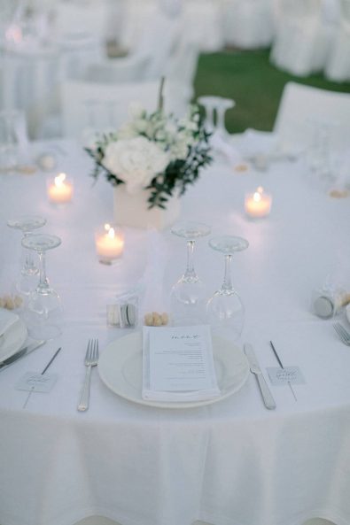 Simple table setting for a white minimal and chic wedding.