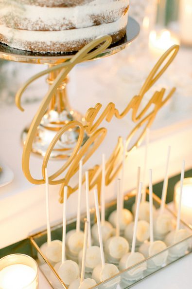 Minimal and chic wedding candy bar decoration on top of candy