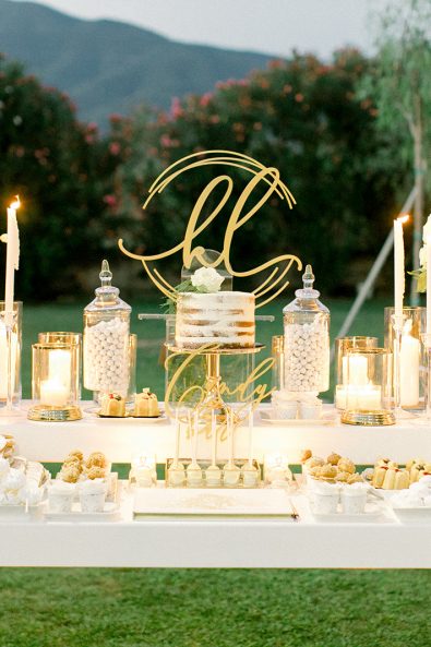 Minimal and chic wedding candy bar full of sweets and candles