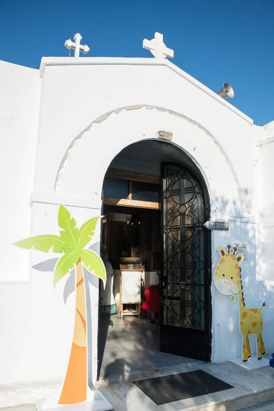White Chapel in Lycabettus Hill with a giraffe and pine tree decorations for a boy baptism.