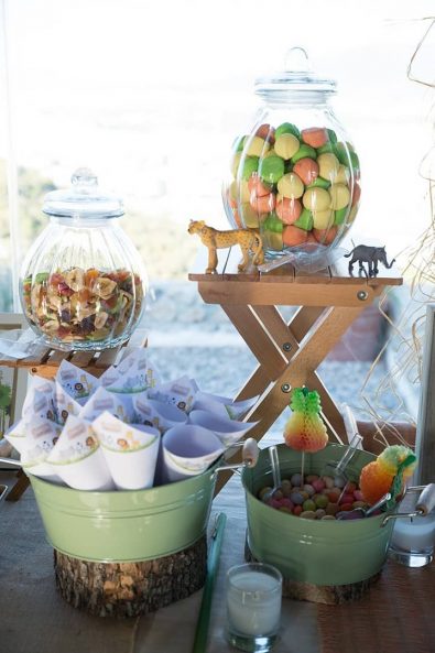Candy bar treats and party paper cones for marshmallows, chocolate crispies, and dried fruits.
