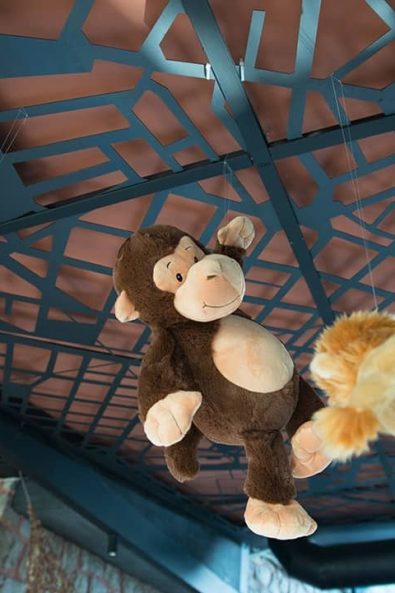 Hanging Party decorations with stuffed animals for a christening after party.
