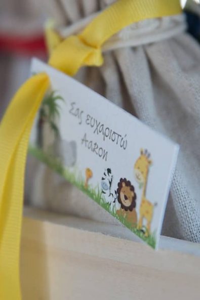 Close up shot of thank you note with jungle animals for a baptism.