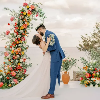 Couple's first kiss after their symbolic ceremony at Lazarou venue in Sifnos island