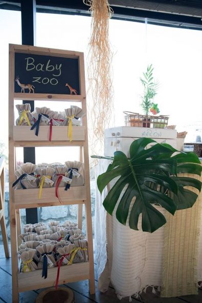 Baptism Party decoration and christening favors with burlap and blue, red and yellow ribbons