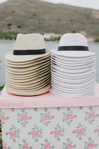 christening ideas - Beige and white straw hats for guests.