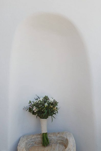 Boho summer bridal bouquet with eucalyptus, chamomile, roses, and alstroemerias.