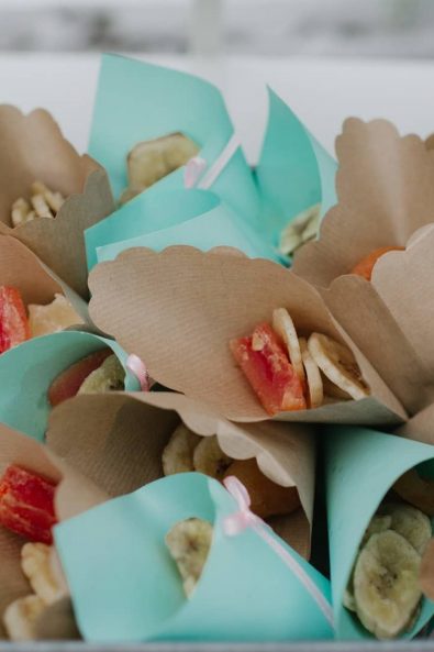 Paper party cones filled with dried bananas and papaya.