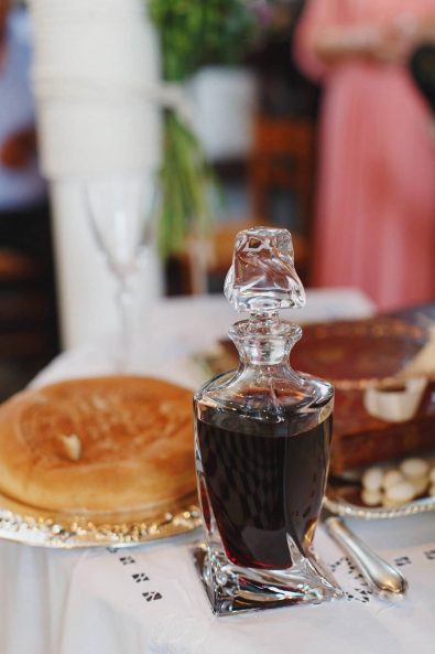 Red wine crystal bottle for a Greek Orthodox wedding.