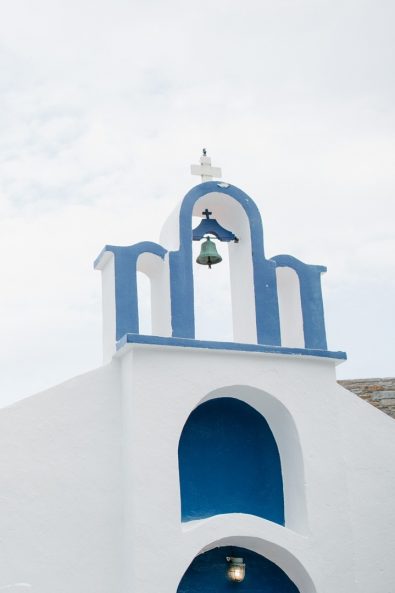 Picturesque Greek island white and blue chapel.