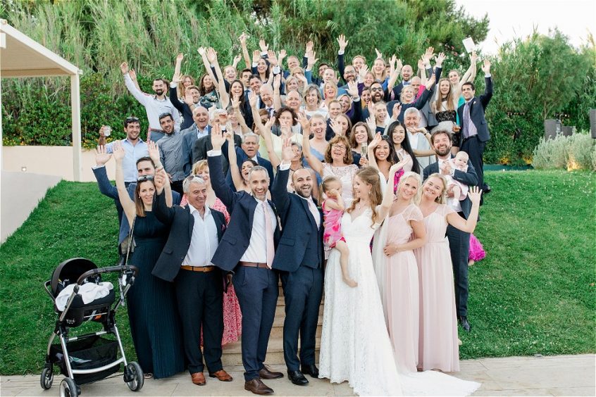 Couple and their guests at their wedding