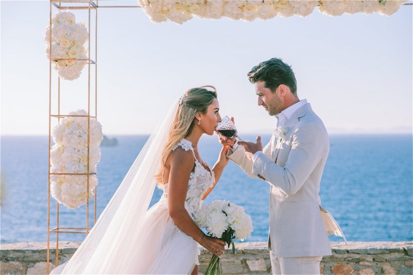 Drinking wine during wedding as part of the Greek wedding traditions