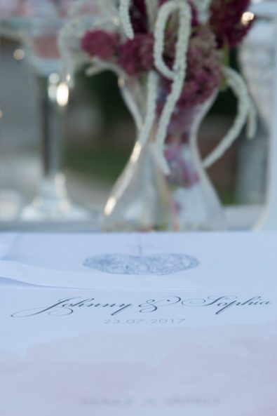 Custom made romantic white wish book with ribbon and calligraphy for the newlyweds.