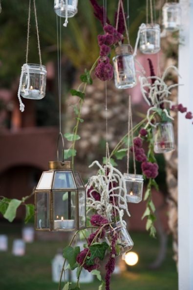 Floating lanterns and flower wedding decorations for a garden wedding.