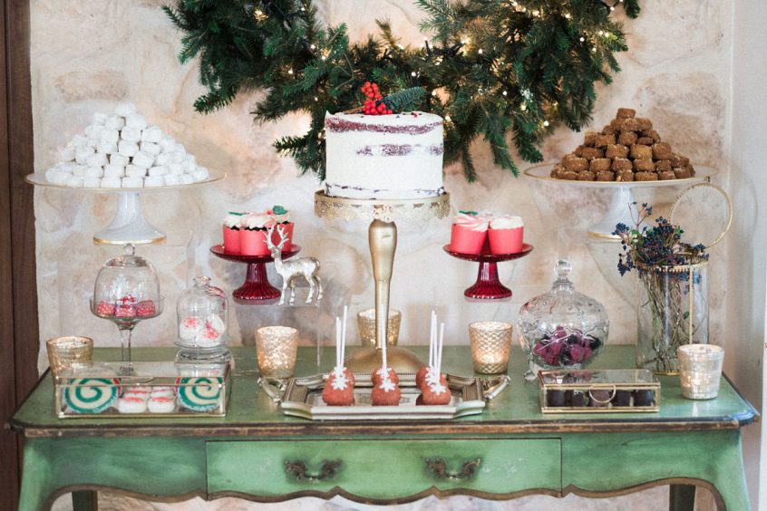 Candy bar with flowers in front of stone wall