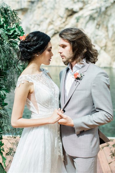 Groom holding brides hand