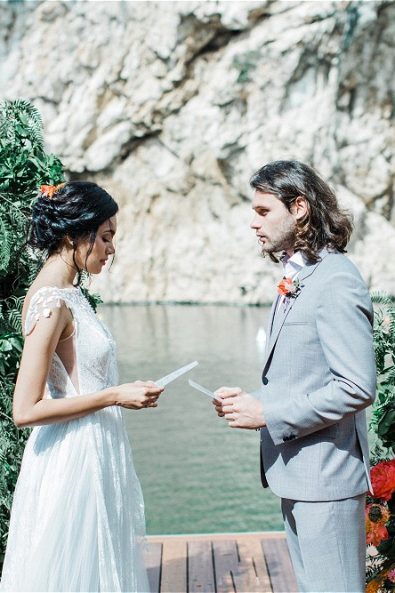 Bride and Groom reading vows at their elopement in Greece