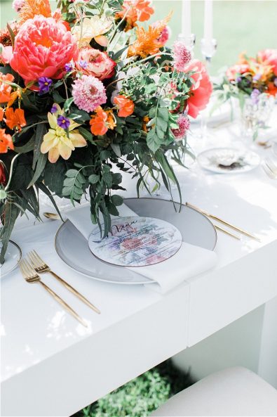 Bouquet in front of plate and menu