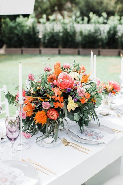 Wedding bouquet, candles and glasses for elopement in Greece